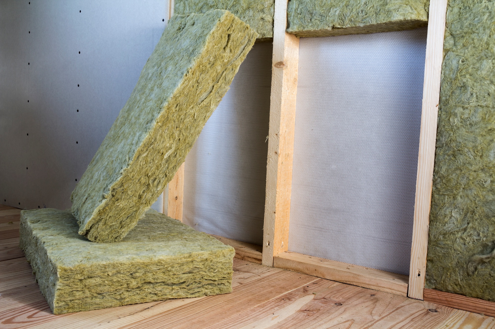 Wooden frame for future walls with drywall plates insulated with rock wool
